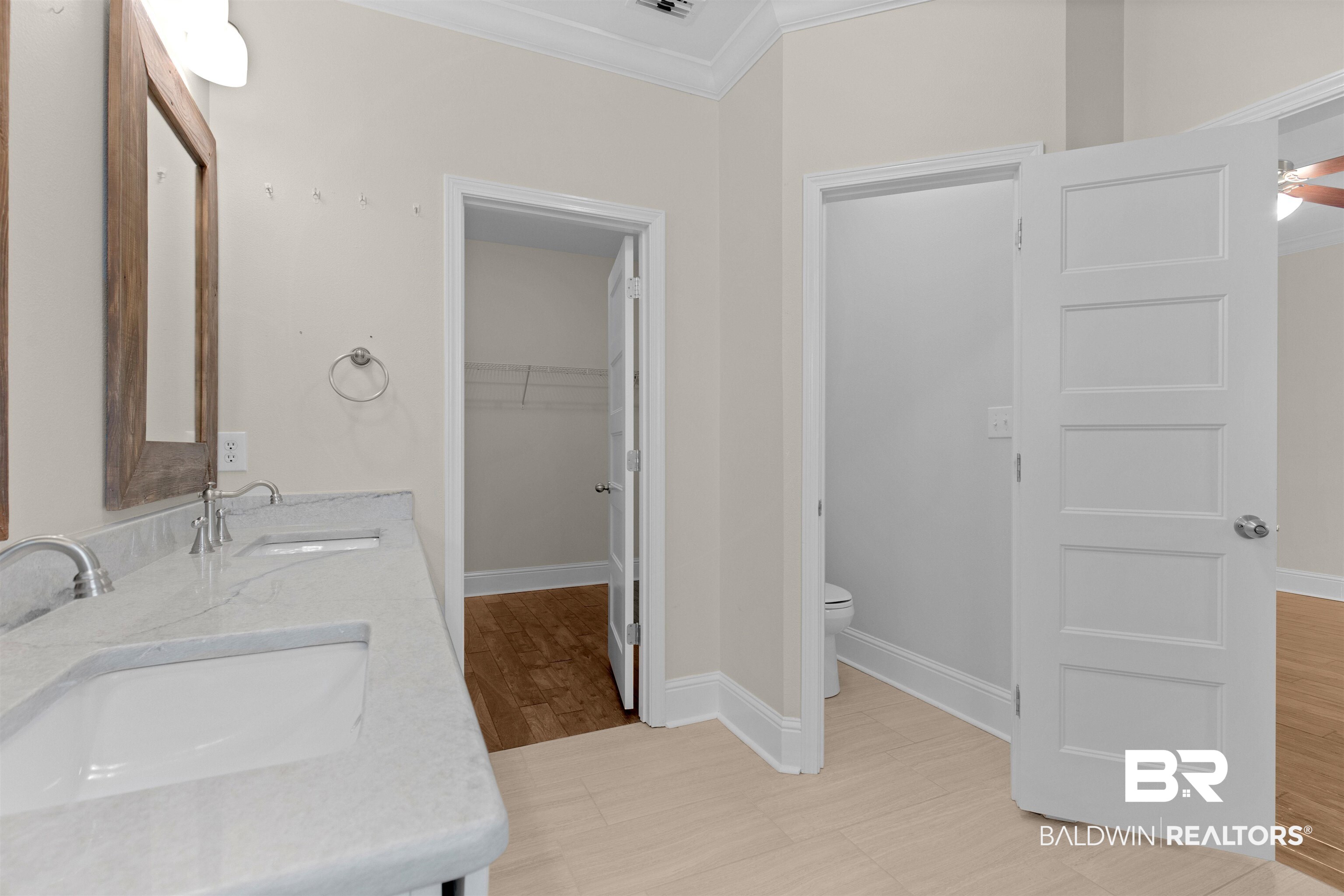 25092 Fairfax Road Daphne, AL 36526 - Photo 23 of 29 Bathroom with vanity, wood-type flooring, ornamental molding, and toilet