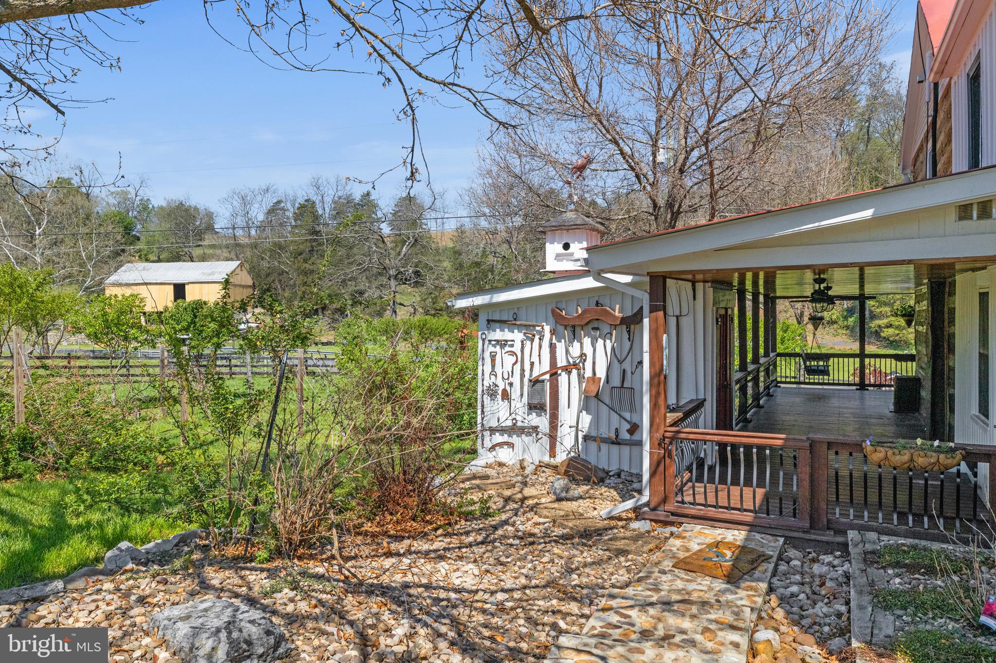 989 Swover Creek Road Edinburg, VA 22824 - Photo 90 of 132 a view of a porch with a yard