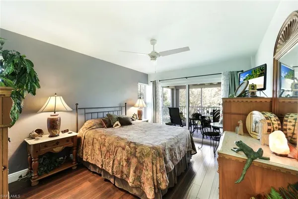 a bed room with a bed and a chair