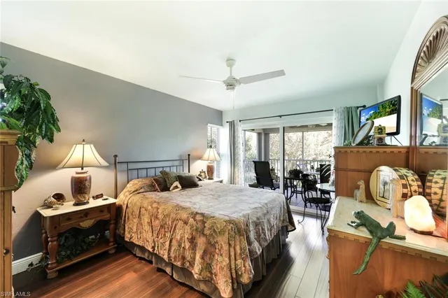 a bed room with a bed and a chair