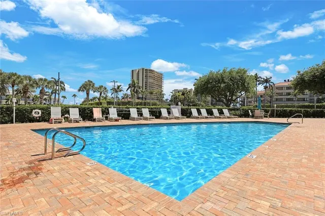 a view of a swimming pool with a lake