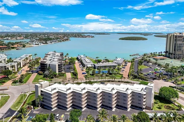 a front view of a building with a garden