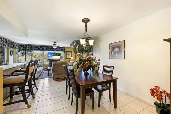 a dining room with furniture and window