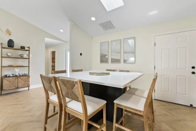 a view of a dining room with furniture and window