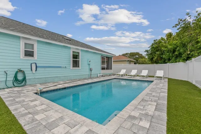a view of living room with furniture and a rug