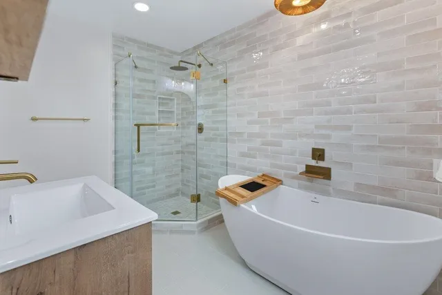 a front view of house with yard and trees in the background