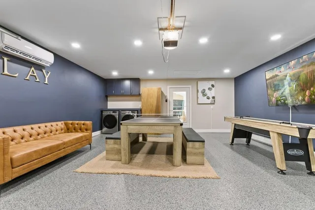 an aerial view of residential houses with outdoor space and trees