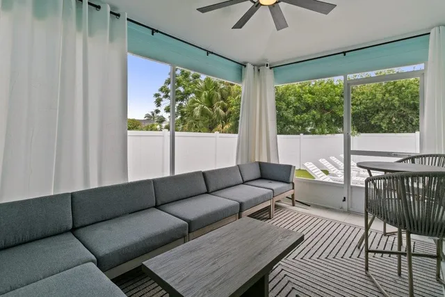 an aerial view of residential houses with outdoor space and street view