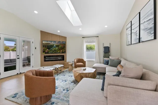 a living room with furniture and a rug