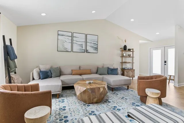 a dining room with a wooden table and chairs