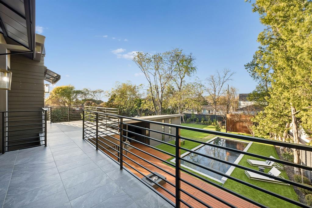 4323 Middleton Road Dallas, TX 75229 - Photo 22 of 40 Private balcony overlooking the backyard with elevated views of the pool, cabana, and grounds. A quiet extension of the home, ideal for morning coffee or evening wind down.