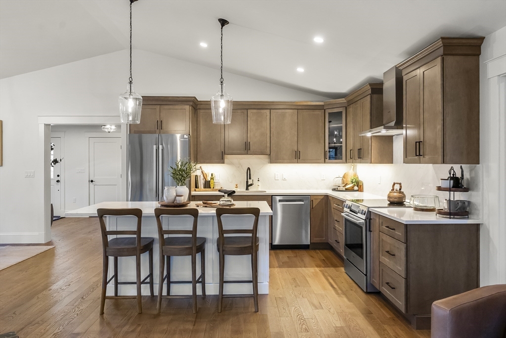 46 Sandwich Road, Unit 39 Plymouth, MA 02360 - Photo 13 of 41 a kitchen with sink cabinets and wooden floor