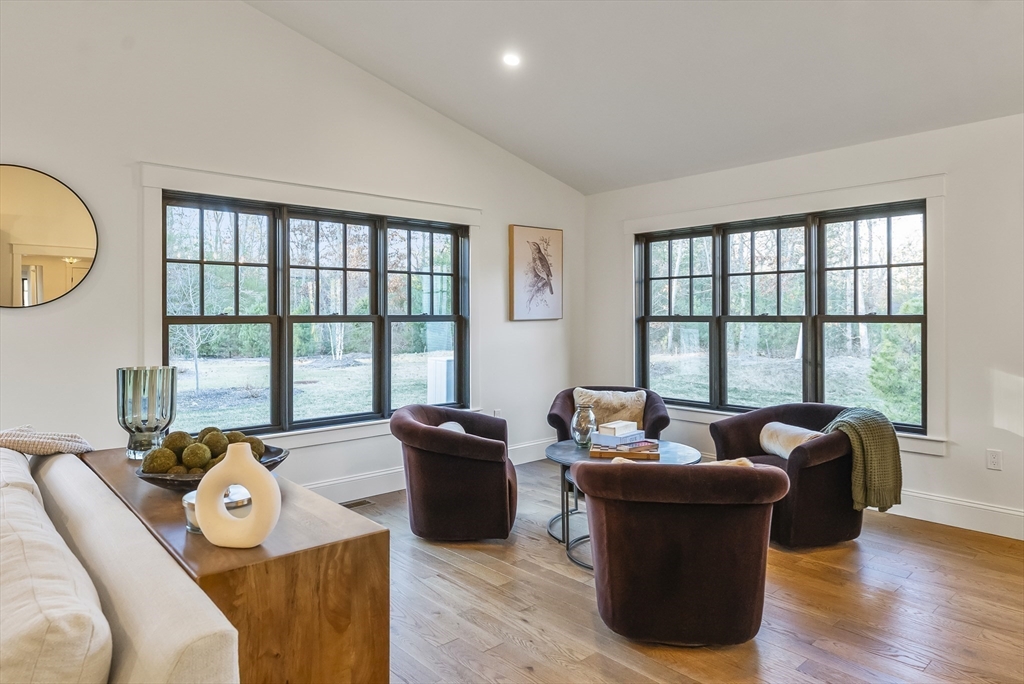 46 Sandwich Road, Unit 39 Plymouth, MA 02360 - Photo 16 of 41 a living room with furniture and a floor to ceiling window