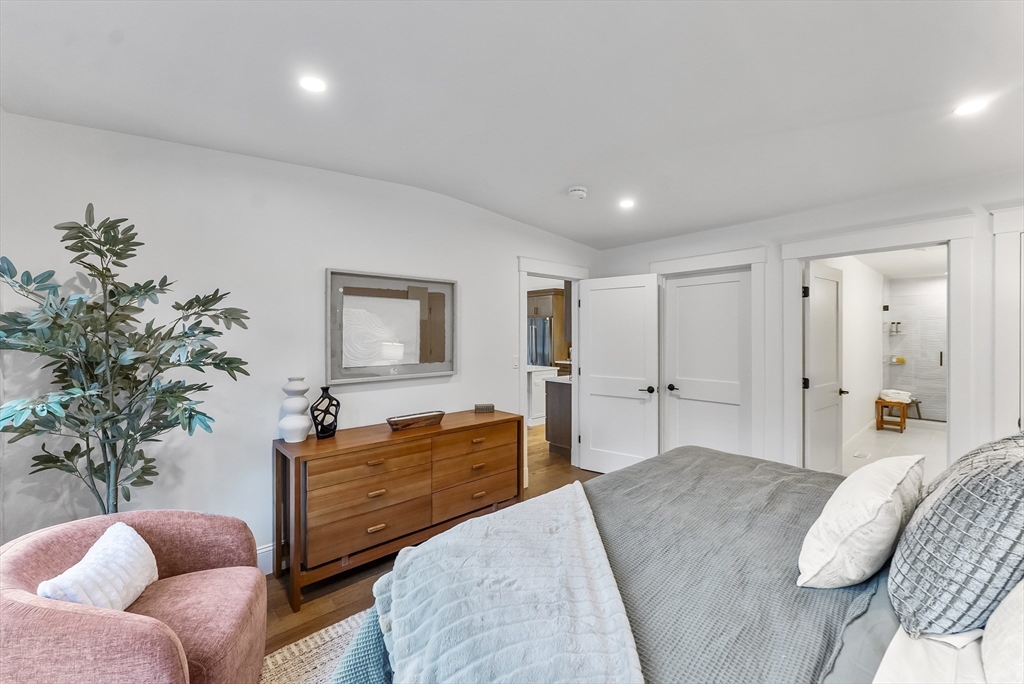 46 Sandwich Road, Unit 39 Plymouth, MA 02360 - Photo 22 of 41 a bedroom with a bed and a couch