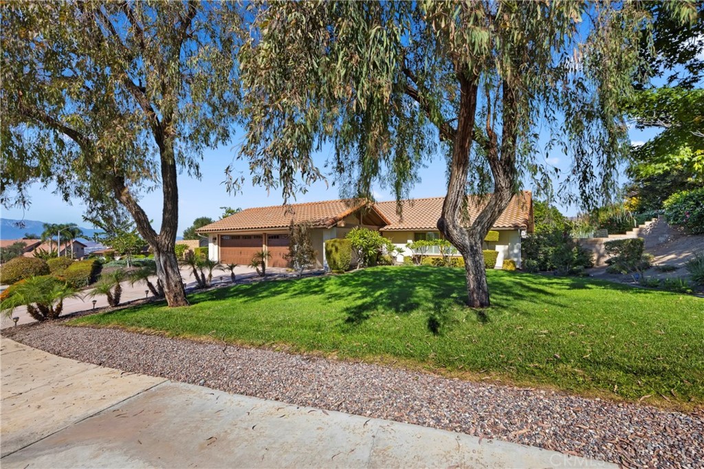 6760 Roanoak Place Riverside, CA 92506 - Photo 1 of 1 a view of a house with a tree in the background