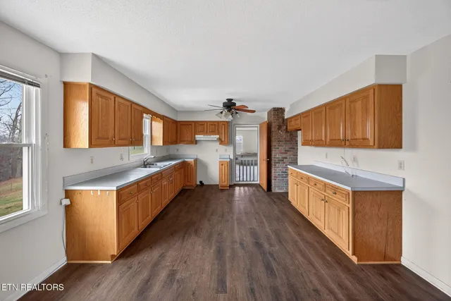 a view of a livingroom with an empty space and a window