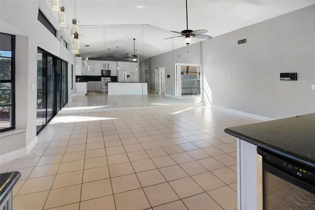 a view of a kitchen with a sink and a stove top oven
