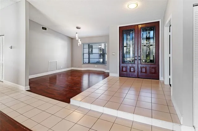 wooden floor in a hall with an entryway