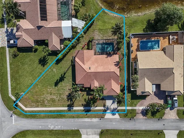 an aerial view of a house with a lake view