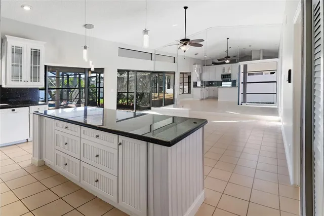 a room with lots of counter space and mirrors