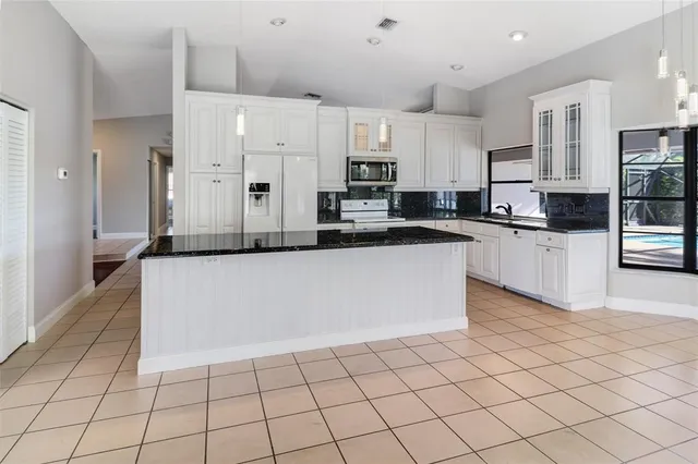 a large kitchen with cabinets