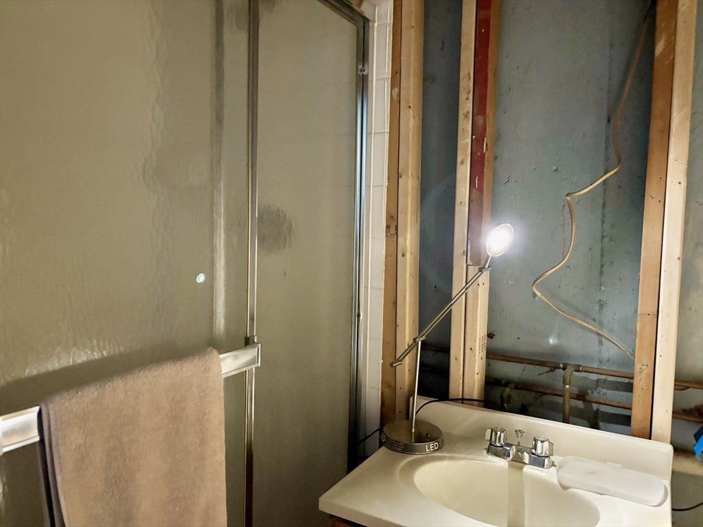 4 Eastern Avenue Burlington, MA 01803 - Photo 19 of 22 a bathroom with a sink and a mirror