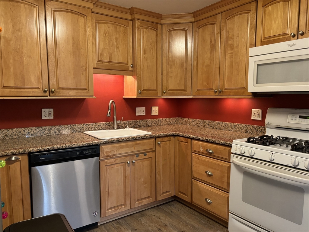 4 Eastern Avenue Burlington, MA 01803 - Photo 6 of 22 a kitchen with a sink and cabinets