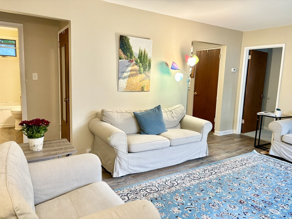 4 Eastern Avenue Burlington, MA 01803 - Photo 10 of 22 a living room with furniture and a flat screen tv