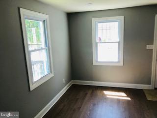 114 46th Street Southeast Washington, DC 20019 - Photo 11 of 21 a view of an empty room with wooden floor and a window