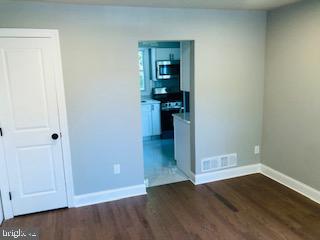 114 46th Street Southeast Washington, DC 20019 - Photo 15 of 21 a view of a hallway with wooden floor and closet