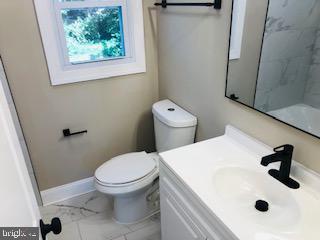 114 46th Street Southeast Washington, DC 20019 - Photo 2 of 21 a bathroom with a sink and a toilet