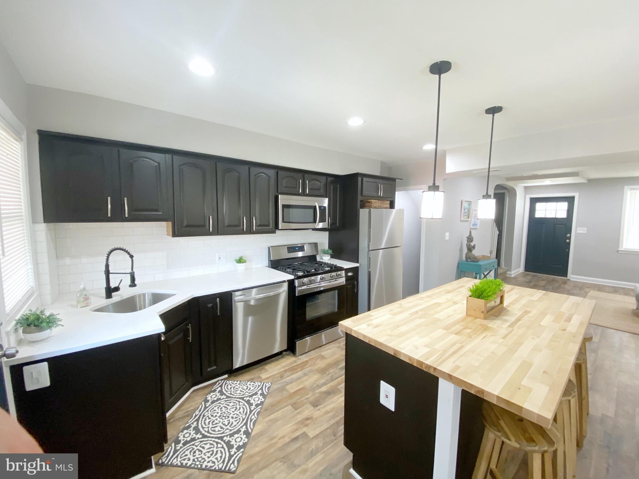 907 Kevin Road Baltimore, MD 21229 - Photo 5 of 17 With NEW Quartz countertop and SS appliances