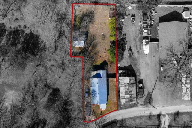 an aerial view of a houses with outdoor space