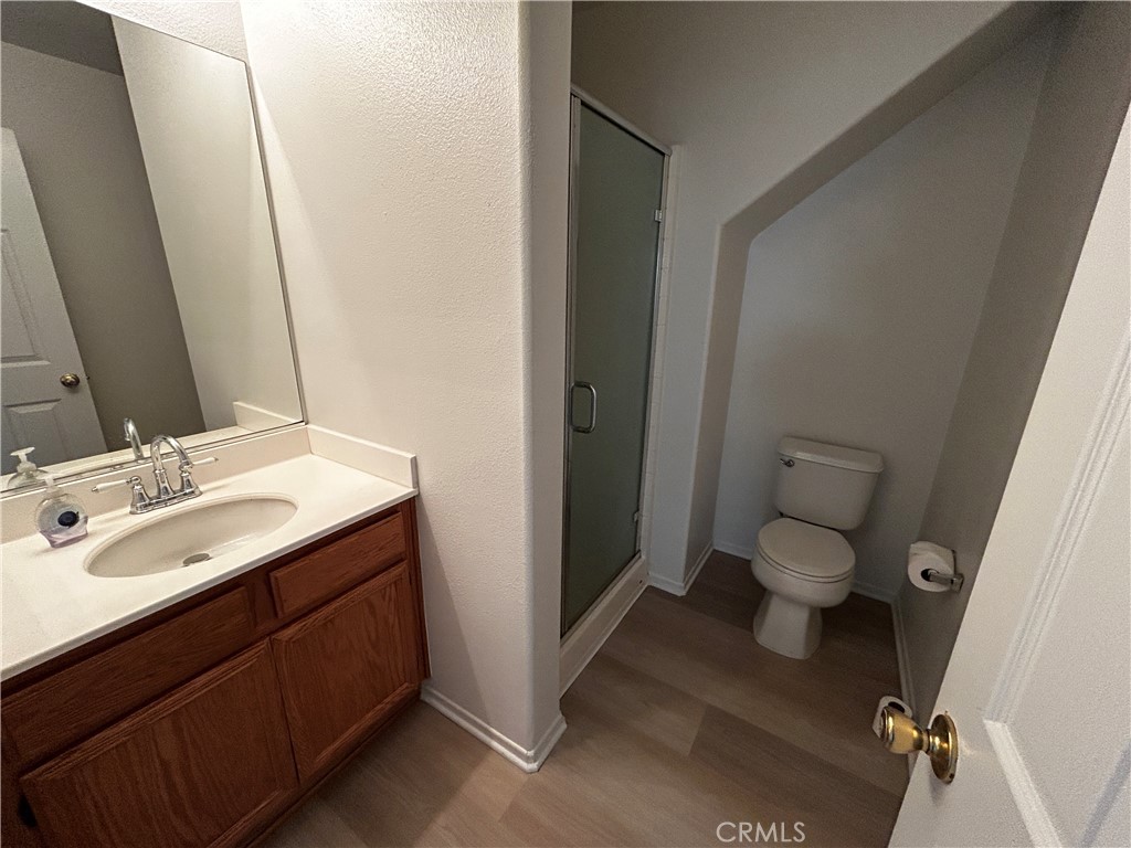 4210 Cloudywing Road Hemet, CA 92545 - Photo 12 of 27 a bathroom with a sink and a mirror