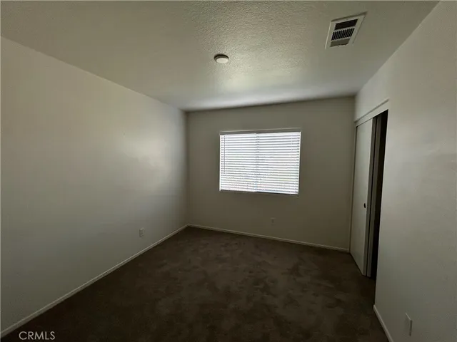 an empty room with a empty space and window