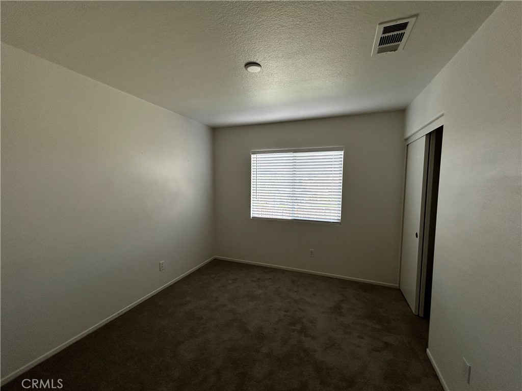 4210 Cloudywing Road Hemet, CA 92545 - Photo 20 of 27 an empty room with a empty space and window
