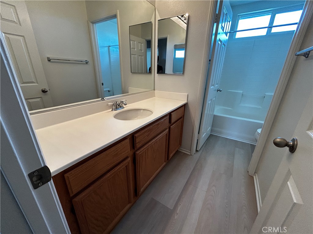 4210 Cloudywing Road Hemet, CA 92545 - Photo 21 of 27 a bathroom with a sink a vanity and a mirror