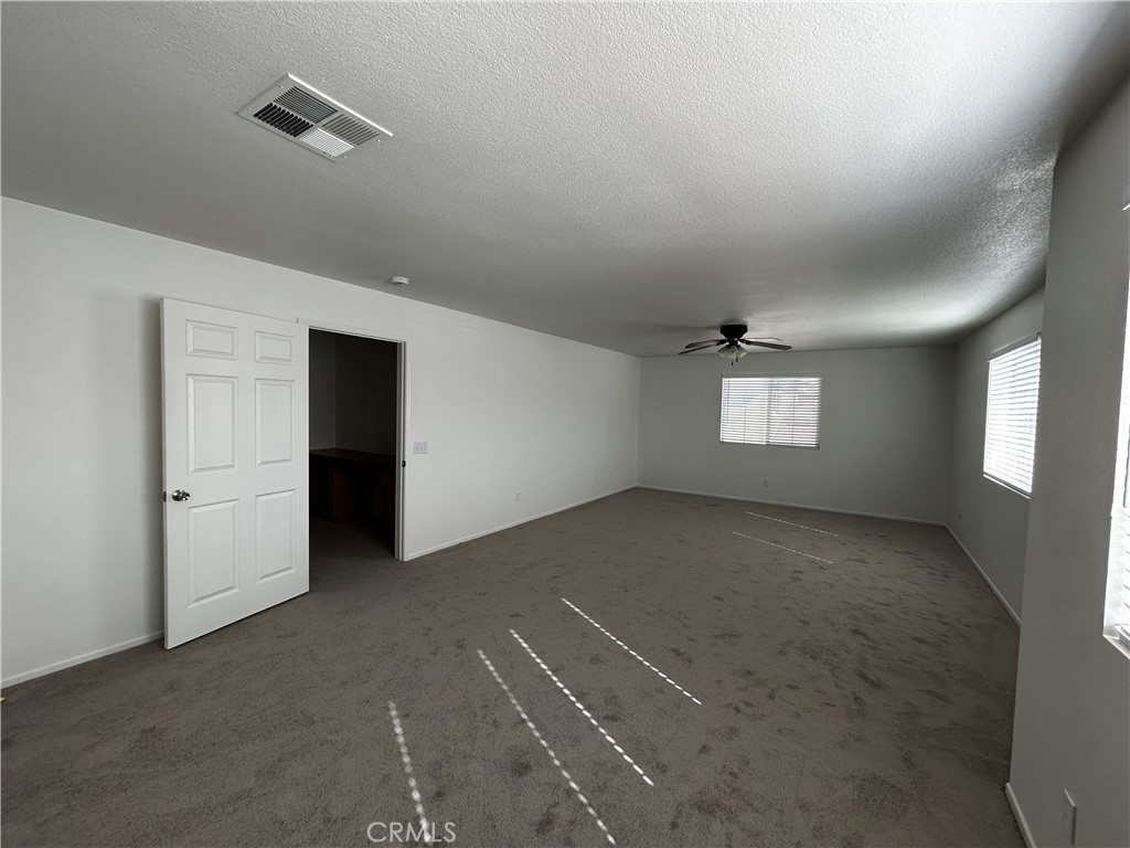 4210 Cloudywing Road Hemet, CA 92545 - Photo 27 of 27 an empty room with windows