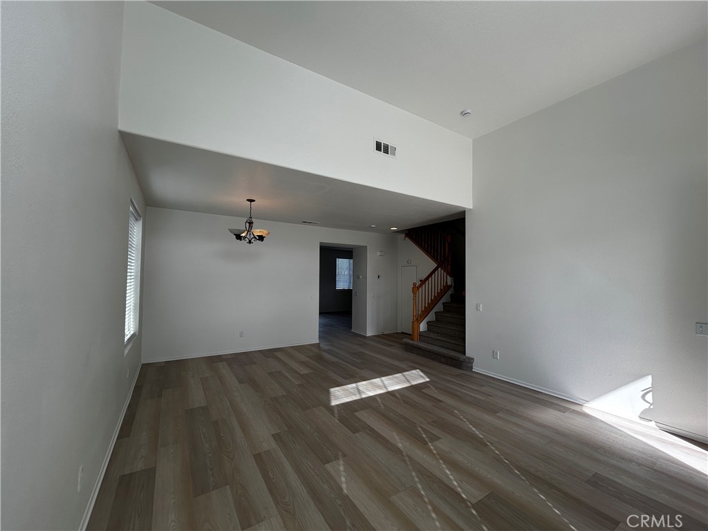 4210 Cloudywing Road Hemet, CA 92545 - Photo 3 of 27 a view of empty room with wooden floor