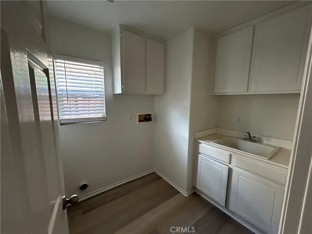 a room with a white cabinets and sink