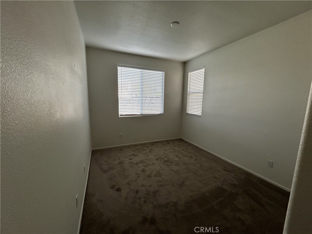 4210 Cloudywing Road Hemet, CA 92545 - Photo 10 of 27 an empty room with a window