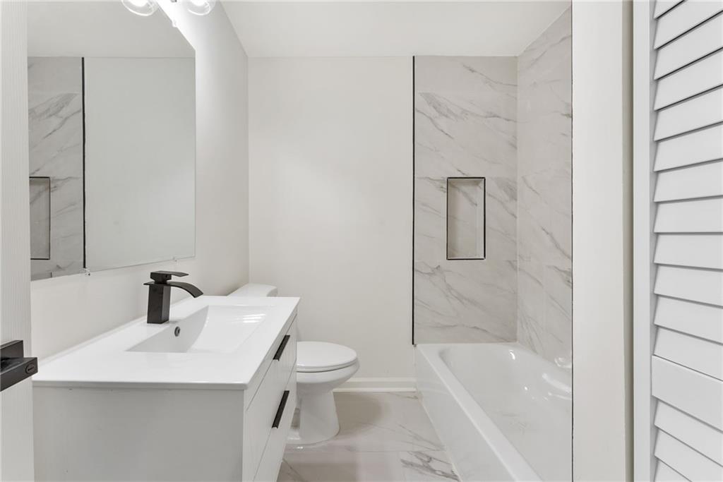 3406 Longleaf Drive Decatur, GA 30032 - Photo 22 of 29 a bathroom with a sink toilet and shower