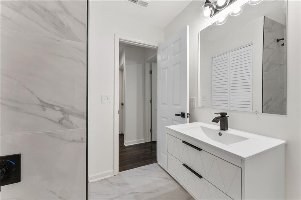 3406 Longleaf Drive Decatur, GA 30032 - Photo 23 of 29 a bathroom with a sink and a mirror