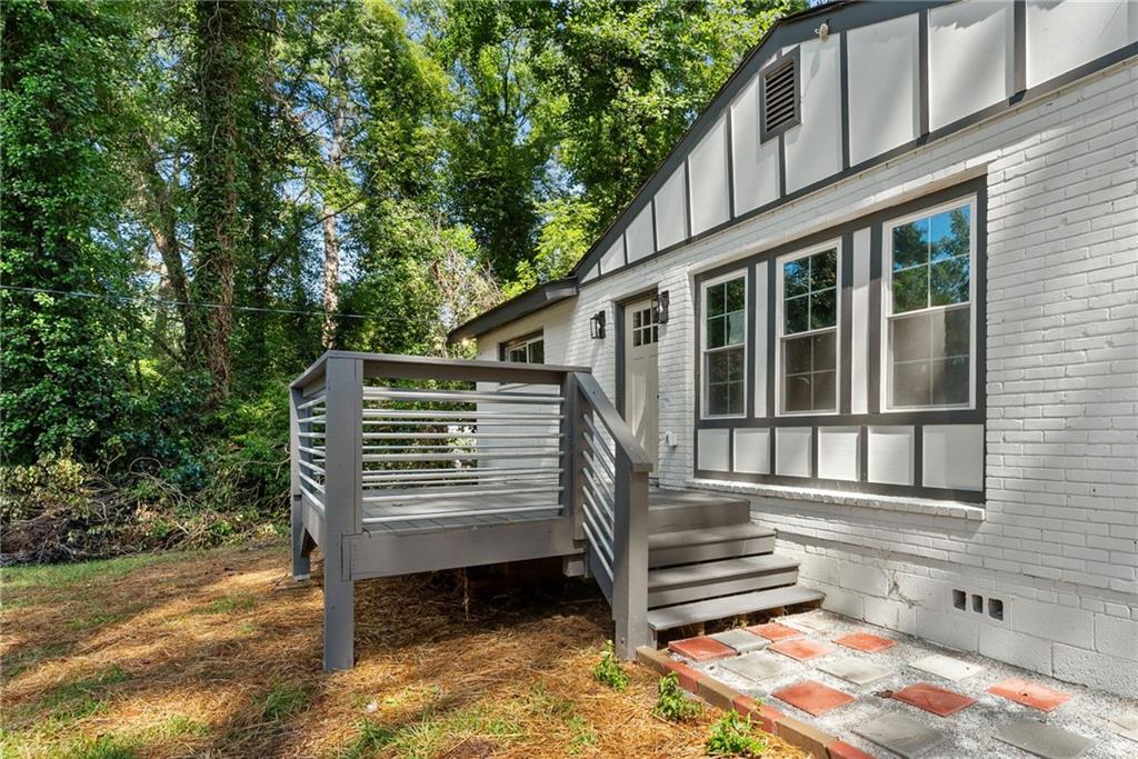 3406 Longleaf Drive Decatur, GA 30032 - Photo 4 of 29 a front view of a house with a bench