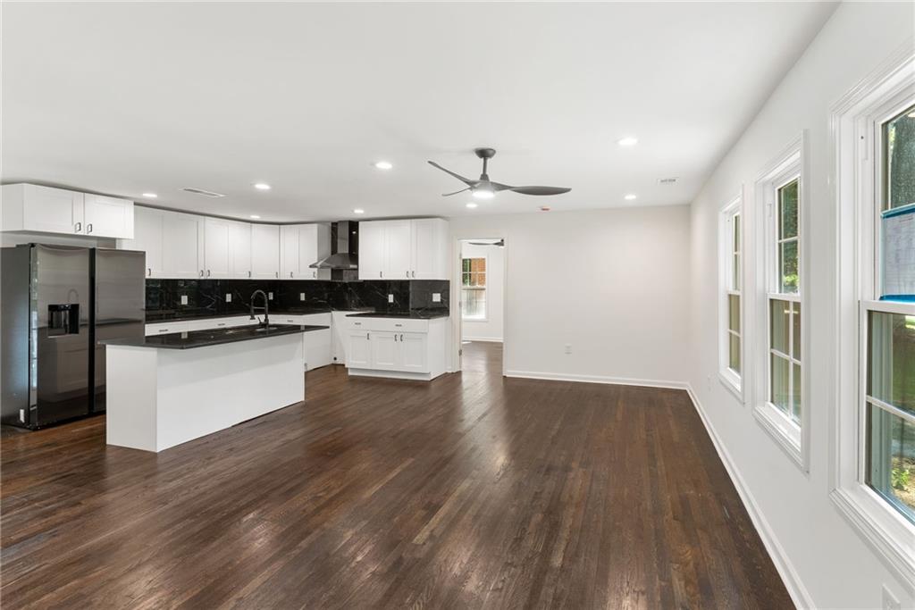 3406 Longleaf Drive Decatur, GA 30032 - Photo 8 of 29 a view of kitchen with granite countertop stainless steel appliances counter space and wooden floor