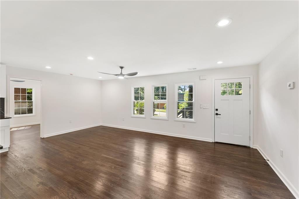 3406 Longleaf Drive Decatur, GA 30032 - Photo 9 of 29 an empty room with wooden floor and windows