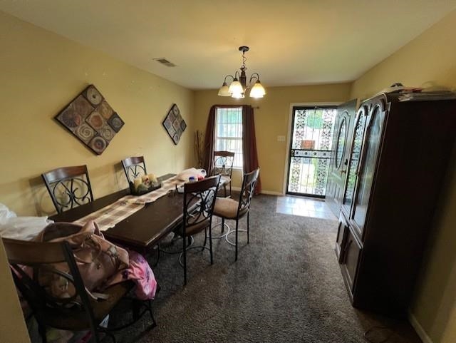 3784 McCain Road Memphis, TN 38109 - Photo 3 of 14 Carpeted interior space featuring a ceiling-mounted light fixture, light-colored walls, and a door with a security screen