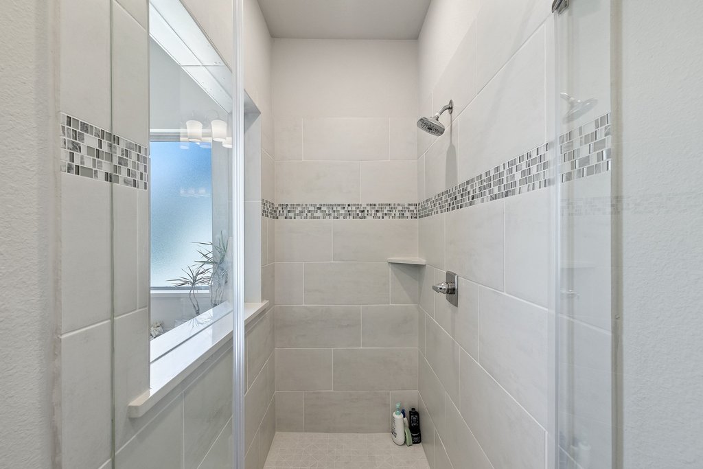 741 Rawson Bend Austin, TX 78738 - Photo 18 of 40 Gorgeous oversized walk-in shower with elegant tile surround.