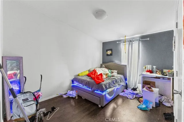 a bedroom with toys and a couch