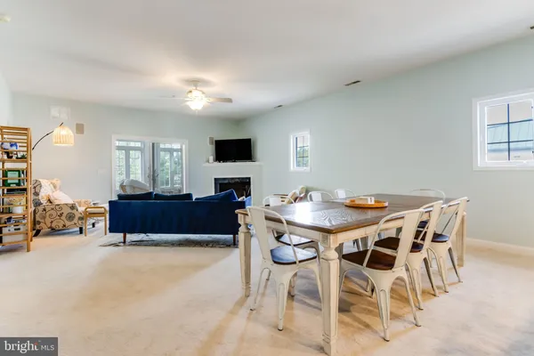 a view of a dining room with furniture and a flat screen tv